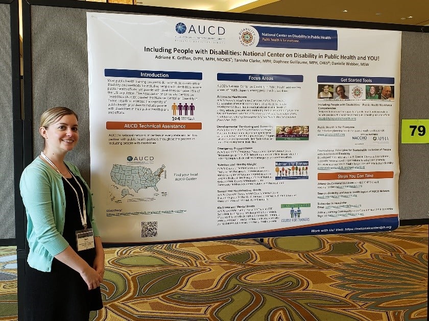 Photo of Sarah Lyons from NACCHO standing next to a poster